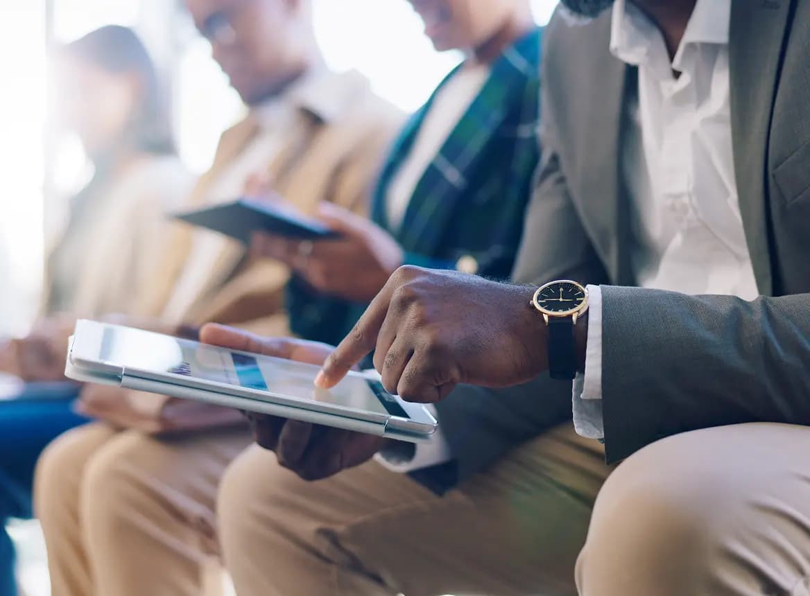 Person Reading File On Tablet Device